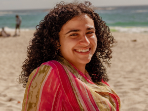 Maya Ghanem sitting on the beach